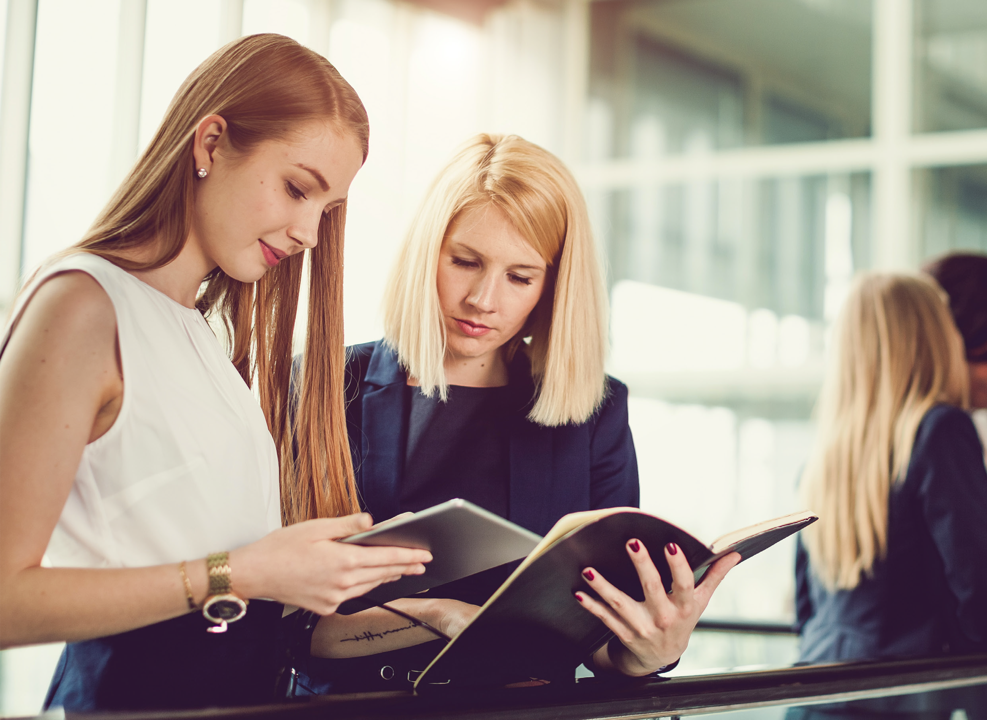 Women hold folder